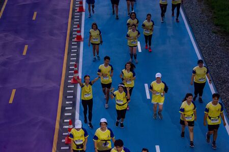 Bangkok, Thailand - May 25, 2019: Unidentified runners running in Happy And Healthy Run For The King at  bicycle lane of Suvarnabhumi international airport,Bangkok,Thailand.のeditorial素材