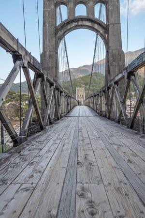 Nagiso,Nagano, Japan - April 20, 2019 : View of historical wooden Momosuke suspension bridge in Nagiso, on the Nakasendo Trail - Nagano Prefecture,  Japan.のeditorial素材