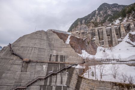 scene of Kurobe dam between Snow wall at Tateyama Kurobe Alpine Route, Japanの写真素材