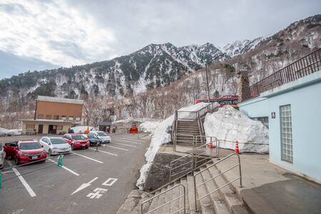Toyama, Japan - April 21, 2019 : View of cars parking at Ogizawa station on Tateyama Kurobe Alpine route in Toyama, Japan.のeditorial素材