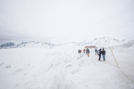 Tateyama, Japan - April 21, 2019 : Unidentified tourists visiting snow corridor on Tateyama Kurobe Alpine Route, Japanese Alp in Tateyama, Japan.のeditorial素材