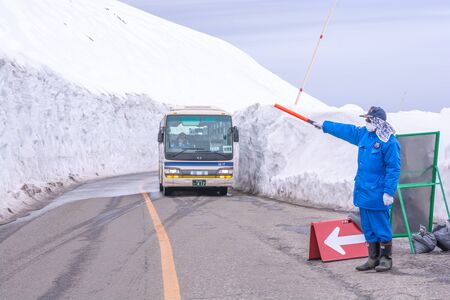 Tateyama, Japan - April 21, 2019 : Unidentified tourists visiting snow corridor on Tateyama Kurobe...