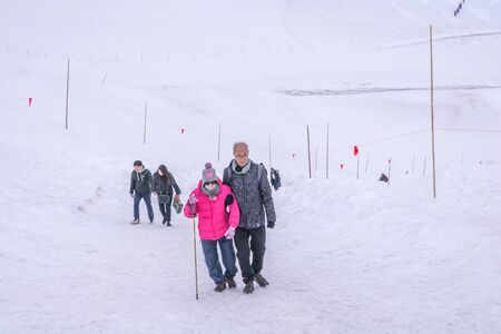 Tateyama, Japan - April 21, 2019 : Unidentified tourists visiting snow corridor on Tateyama Kurobe...