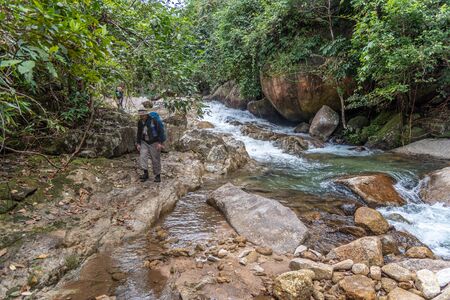 Phatthalung, Thailand-January  01, 2020 : The trekkers trekking on the mountains in jungle of Phatthalung, Thailand.のeditorial素材