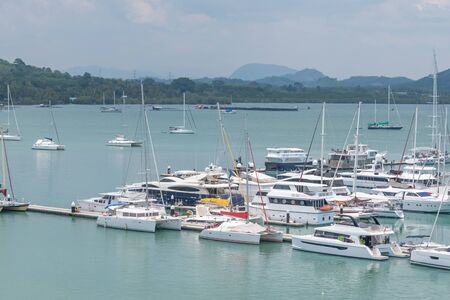 Phuket, Thailand - April 2019 : Row of yachts at the harbor and Many luxury boats at Phuket Yachts Haven Marina in Phuket Thailand.のeditorial素材