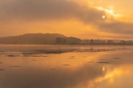 Morning nature scene, sky, clouds and fog (mist) on the lake ,sunrise shotの写真素材