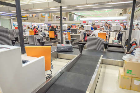 Bangkok,Thailand - April 04,2019 : Interior with passenger check in at Air Asia counters in Don Muang International Airport,Bangkok,Thailand.のeditorial素材