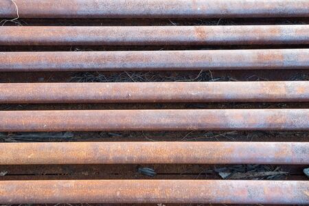 Steel railroad tracks with rust  backgroundの写真素材