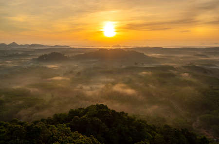 Landscape of beautiful morning fog sunrise in Surat Thani southern of Thailandの写真素材