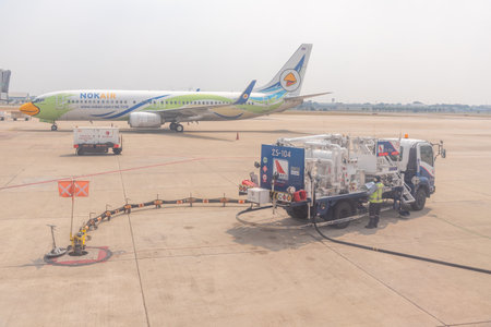 Bangkok, Thailand- January 24 2021 : Airline crew refueling of the aircraft at Don Mueang airport (DMK) in Bangkok ,Thailand.のeditorial素材