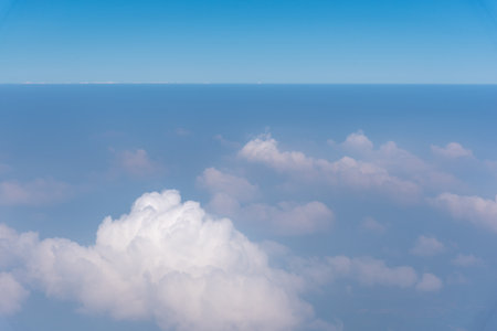 blue sky background with beautiful natural white cloudsの写真素材
