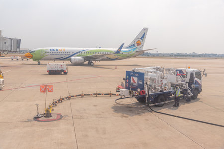 Bangkok, Thailand- January 24 2021 : Airline crew refueling of the aircraft at Don Mueang airport (DMK) in Bangkok ,Thailand.のeditorial素材