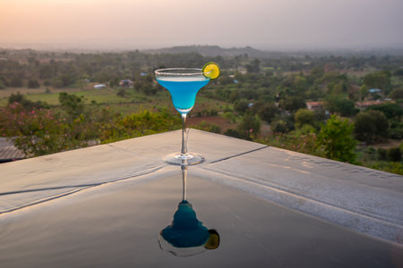 Cocktail near the swimming pool at sunset in Thailandの写真素材
