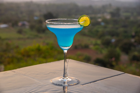 Cocktail near the swimming pool at sunset in Thailandの写真素材