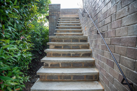 The steps outside with a brick wall and tree old staircaseの写真素材