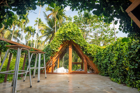Beautiful rooftop bedroom with table and chair outside terrace with trees natureの写真素材