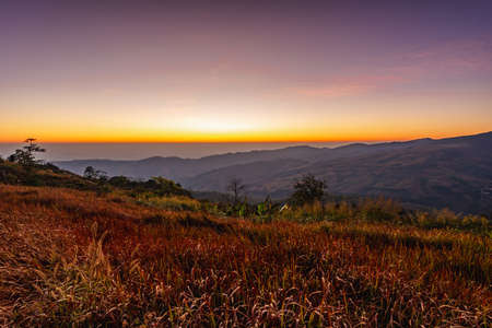 beautiful landscape with mountain on sunrise ,northern in Thailandの写真素材