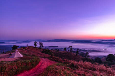 Loei,Thailand - January, 07,2022 : Tent camping on the mountain before sunrise landscape at Loei province, Thailand.のeditorial素材