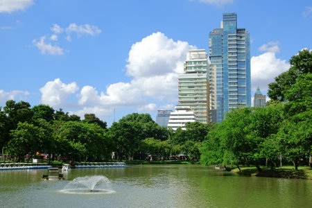Lake view of Lumpini Park in the Thai capital's city centre on october 10, 2014 in Bangkok, Thailand. Lumpini Park covers 142 acres with 2.5 km of pathways and a large boating lake.のeditorial素材