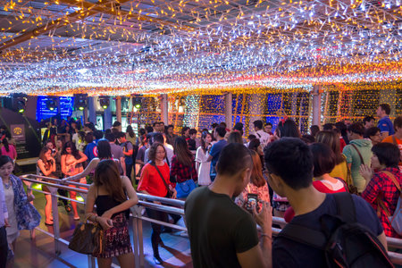 BANGKOK -Thai people walking at Thailand kingdom of light festival on BTS skywalk ratchaprasong...