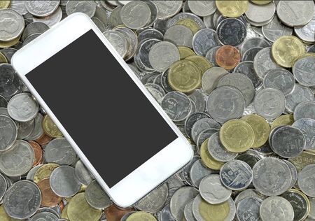 smartphone on a coinsの写真素材