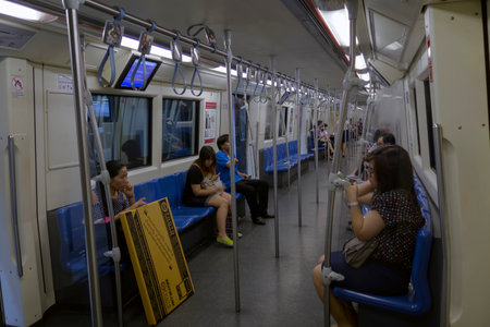 BANGKOK : Passengers on a Metropolitan Rapid Transit (MRT) subway train on 26 february 2015 in Bangkok. Thailand. The MRT serves 240,000 people daily with 18 stations and 27 km of track.のeditorial素材