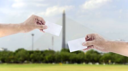 hand exchanging a cardの写真素材