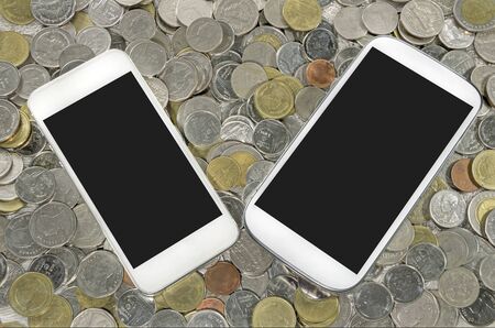 smartphone on a coinsの写真素材