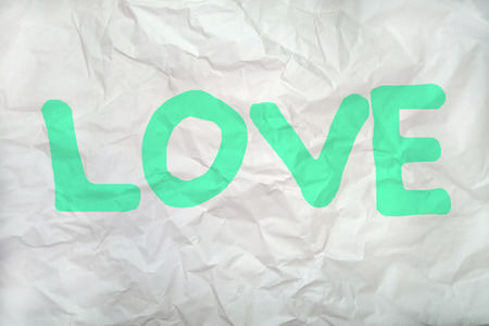love word on a wrinkled paperの写真素材