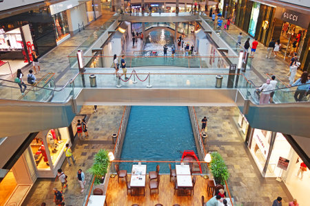 SINGAPORE - 12 October 2018: Canal and boat at The Shoppes at Marina Bay Sands Shopping Center in Singaporeのeditorial素材