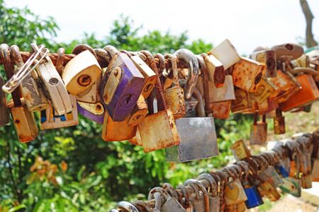 master key lock by lover couple at Noen Nangphaya View Point , Chanthaburi, Thailand.の写真素材
