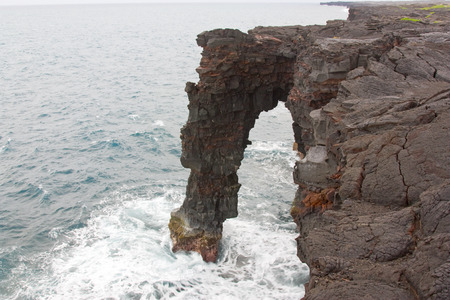 Picture taken in Hawaii. Sea arch is composed of basaltic lavaの写真素材