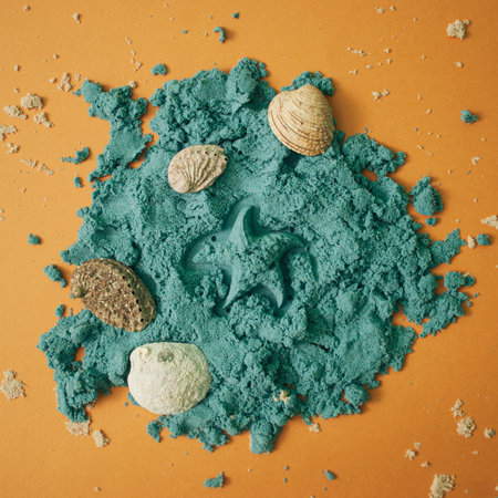 Creative blue send with shells and star made of send on the natural orange background. Flat layout.の写真素材