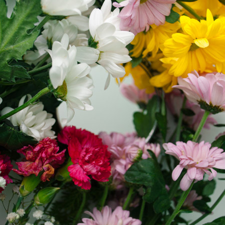 Mirror surrounded with colorful flowers. Natural concept.の写真素材