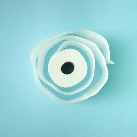 Maze circle made of white toilet paper roll on light pastel blue background. Copy space, flat lay.の写真素材