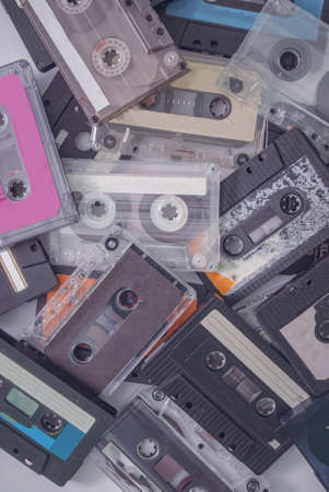 Set of old retro audio cassettes on white background. Best of 90's hits. Flat lay, creative concept.の写真素材