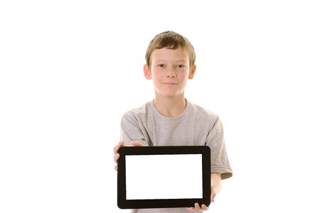 Young boy holding a tablet computer with copy spaceの写真素材