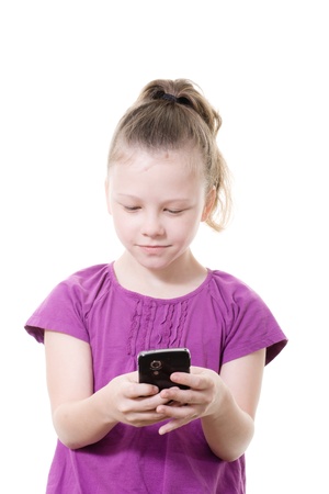 young girl sending a text messageの写真素材