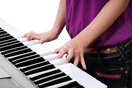 close up of young girl  playing keyboardの写真素材