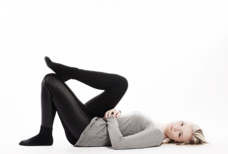 slim girl lying on whiteの写真素材