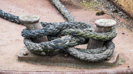 old mooring rope tied to a boatの写真素材