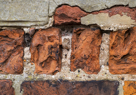 close up of badly weathered bricks with some repairsの写真素材