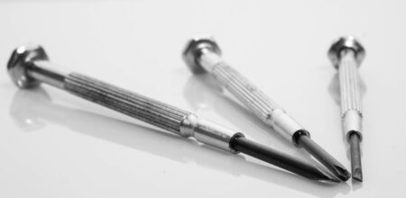 Set of three jewellers scredrivers on a white background with shallow depth of fieldの写真素材