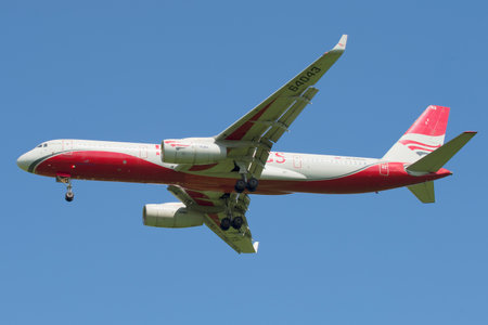ST. PETERSBURG, RUSSIA - JUNE 29, 2015: Flying the TU-204-100B airline Red Wings against the blue skyのeditorial素材