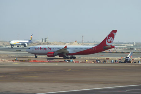 ABU DHABI, UAE - MARCH 27, 2015: Airbus A330 D-ALPD company Air Berlin on the tarmac of Abu Dhabi airportのeditorial素材