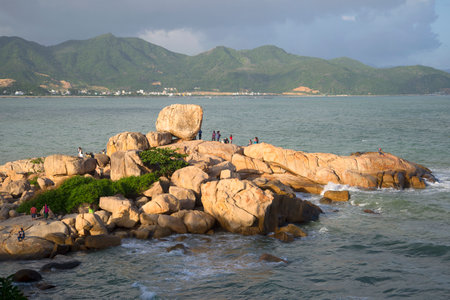 NHA TRANG, VIETNAM - DECEMBER 30, 2015: People are walking over boulders in a Stone garden "Hon Chong"のeditorial素材