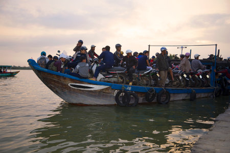 HOI AN, VIETNAM - JANUARY 02, 2016: A ferry with passengers departs from the pierのeditorial素材