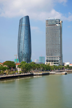 DA NANG, VIETNAM - JANUARY 06, 2016: Two modern high-rise building standing on the river bank in Da Nangのeditorial素材