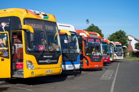 DALAT, VIETNAM - DECEMBER 28, 2015: Colorful long-distance buses are at the bus station of da lat beforeのeditorial素材