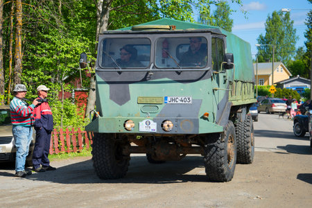 KERIMYAKI, FINLAND - JUNE 06, 2015: People look at a military truck of the Finnish "Sisu" at the parade of vintage vehiclesのeditorial素材